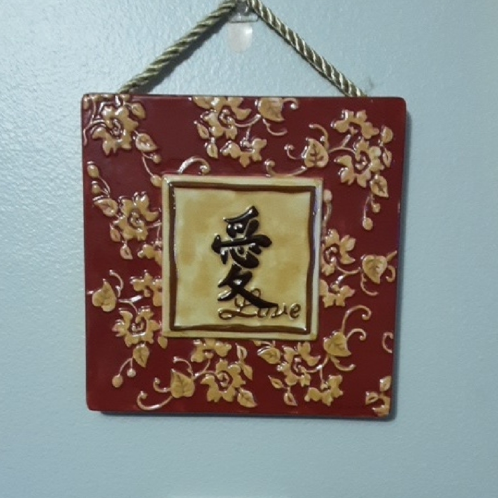 Red and Gold Wall Hanging with Floral Design
